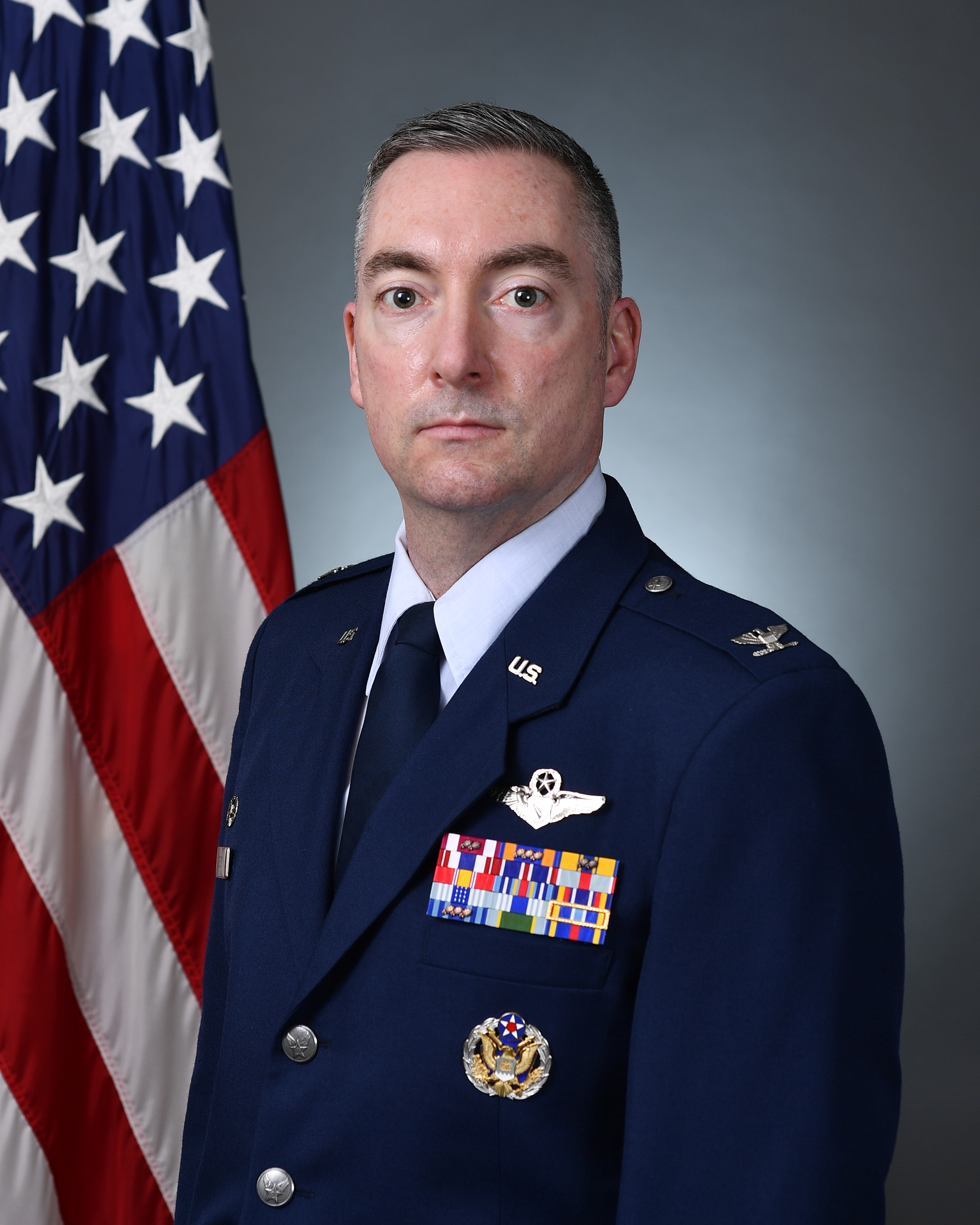 Official photo of Col. Shayne R. Yorton with U.S. flag in background
