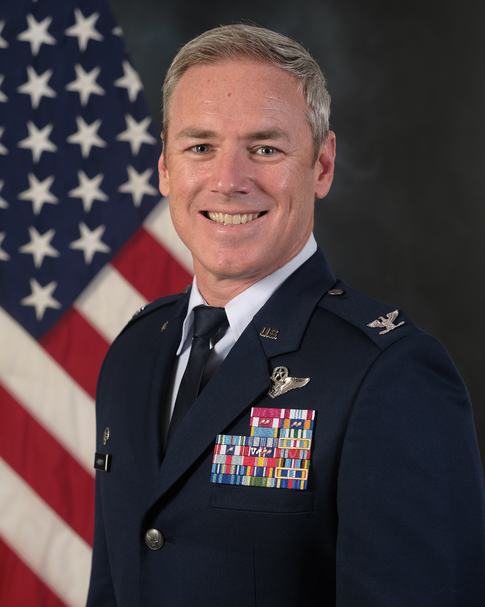Col Frederick "Trey" Coleman with a U.S. Flag in background